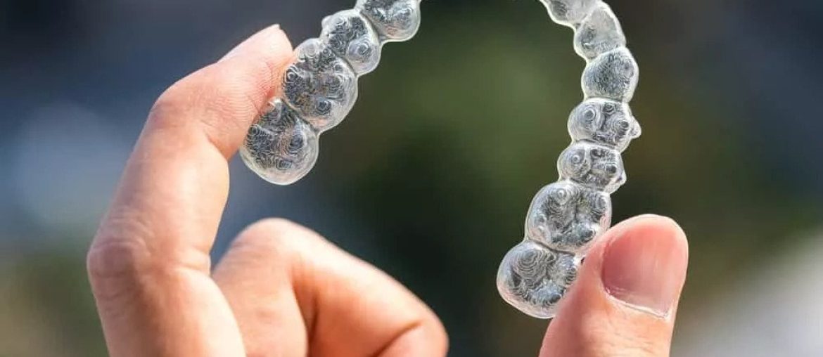 hand holding an Invisalign®