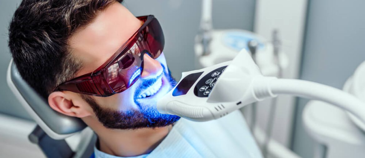 Man at clinic getting Zoom Teeth Whitening